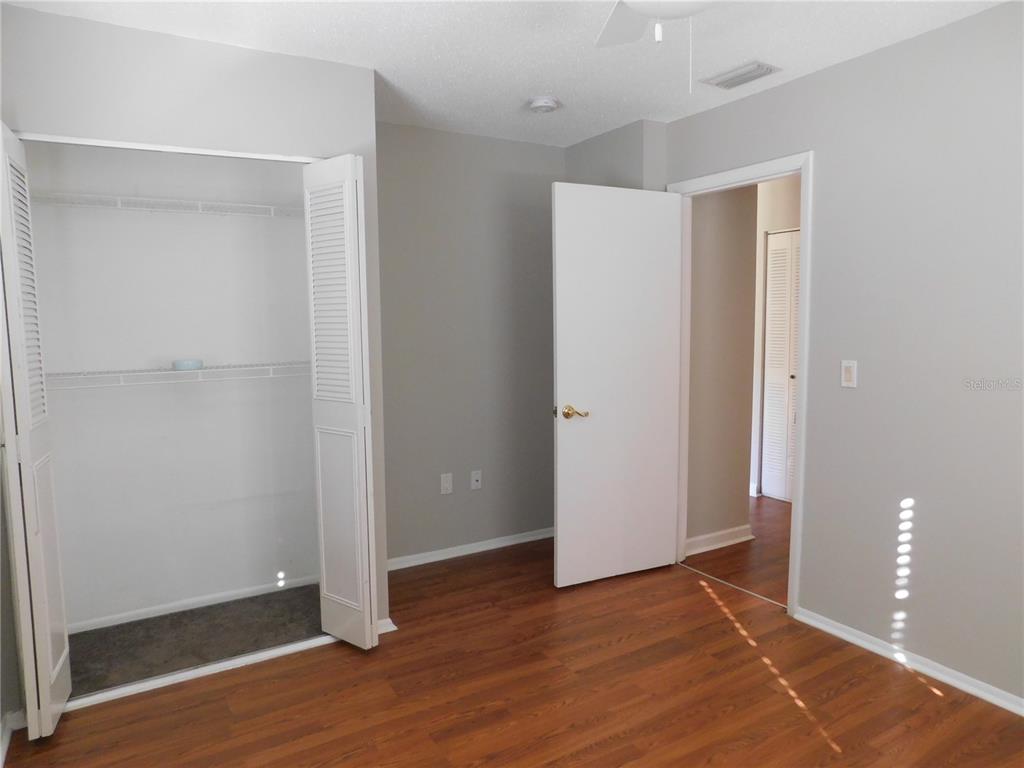 508 65th Avenue West Bradenton, FL 34207 - Photo 19 of 33 a view of an empty room with wooden floor