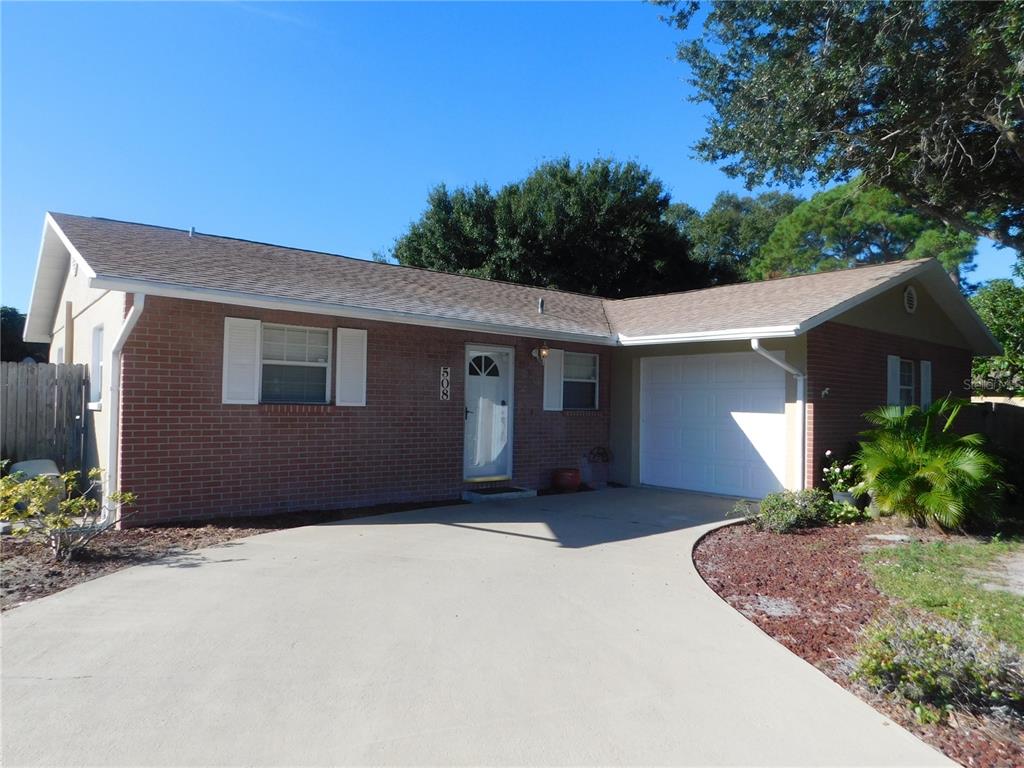 508 65th Avenue West Bradenton, FL 34207 - Photo 32 of 33 a front view of a house with a yard