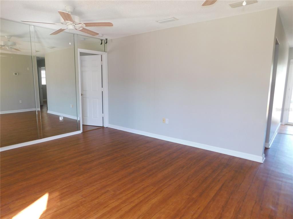 508 65th Avenue West Bradenton, FL 34207 - Photo 5 of 33 a view of a hallway with wooden floor