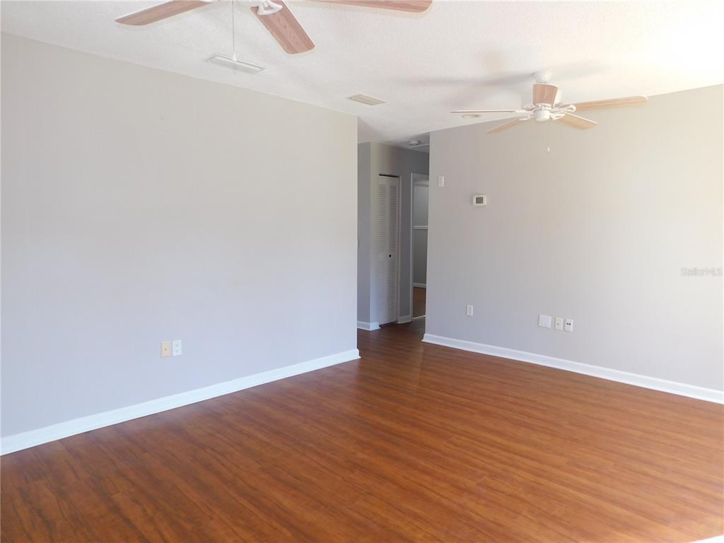 508 65th Avenue West Bradenton, FL 34207 - Photo 6 of 33 a view of an empty room with wooden floor