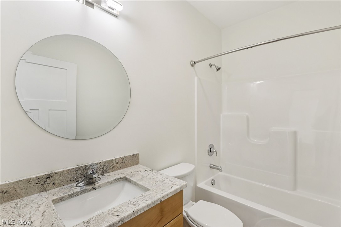 6535 North Ridge Road West Geneva, OH 44041 - Photo 33 of 48 Full bathroom featuring vanity and shower / washtub combination