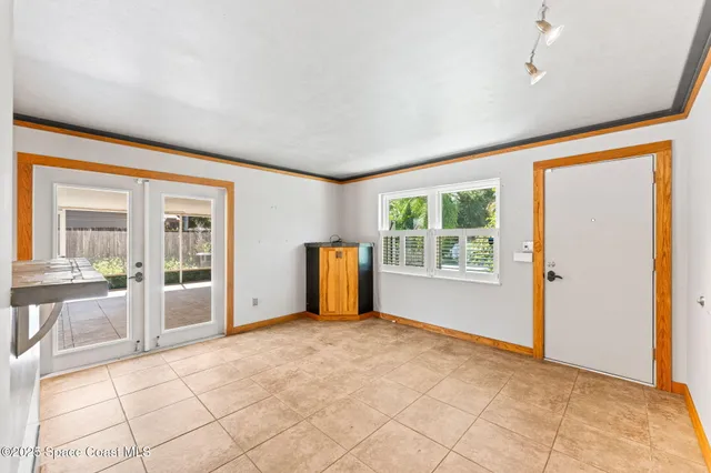 a view of a house with potted plants in front of it
