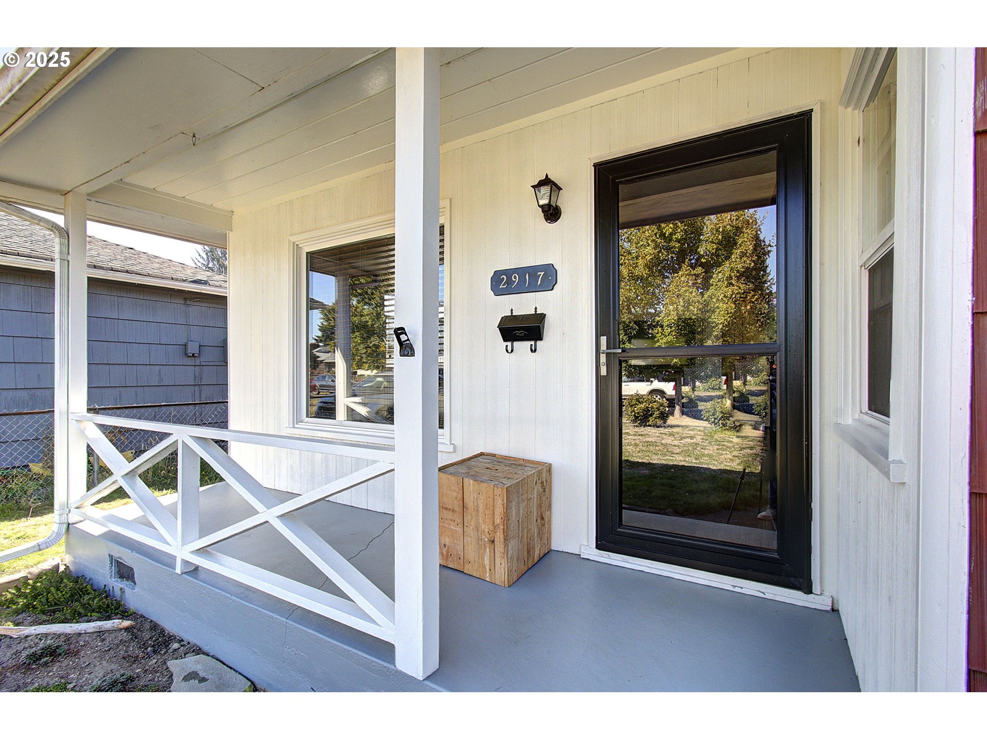 2917 Colorado Street Longview, WA 98632 - Photo 3 of 11 a living room with a couch and a dining table with balcony