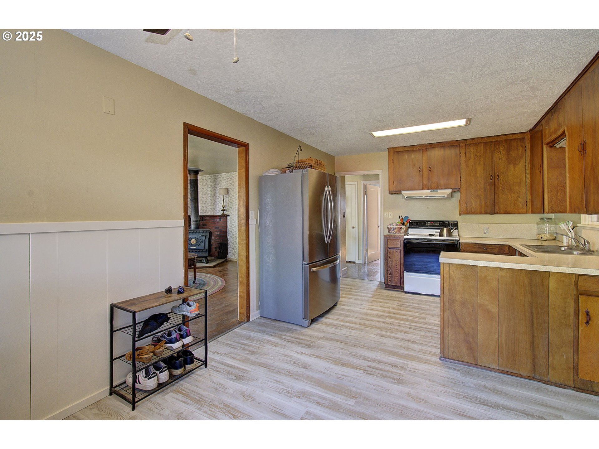 2917 Colorado Street Longview, WA 98632 - Photo 8 of 11 a kitchen with stainless steel appliances granite countertop a refrigerator and a stove top oven
