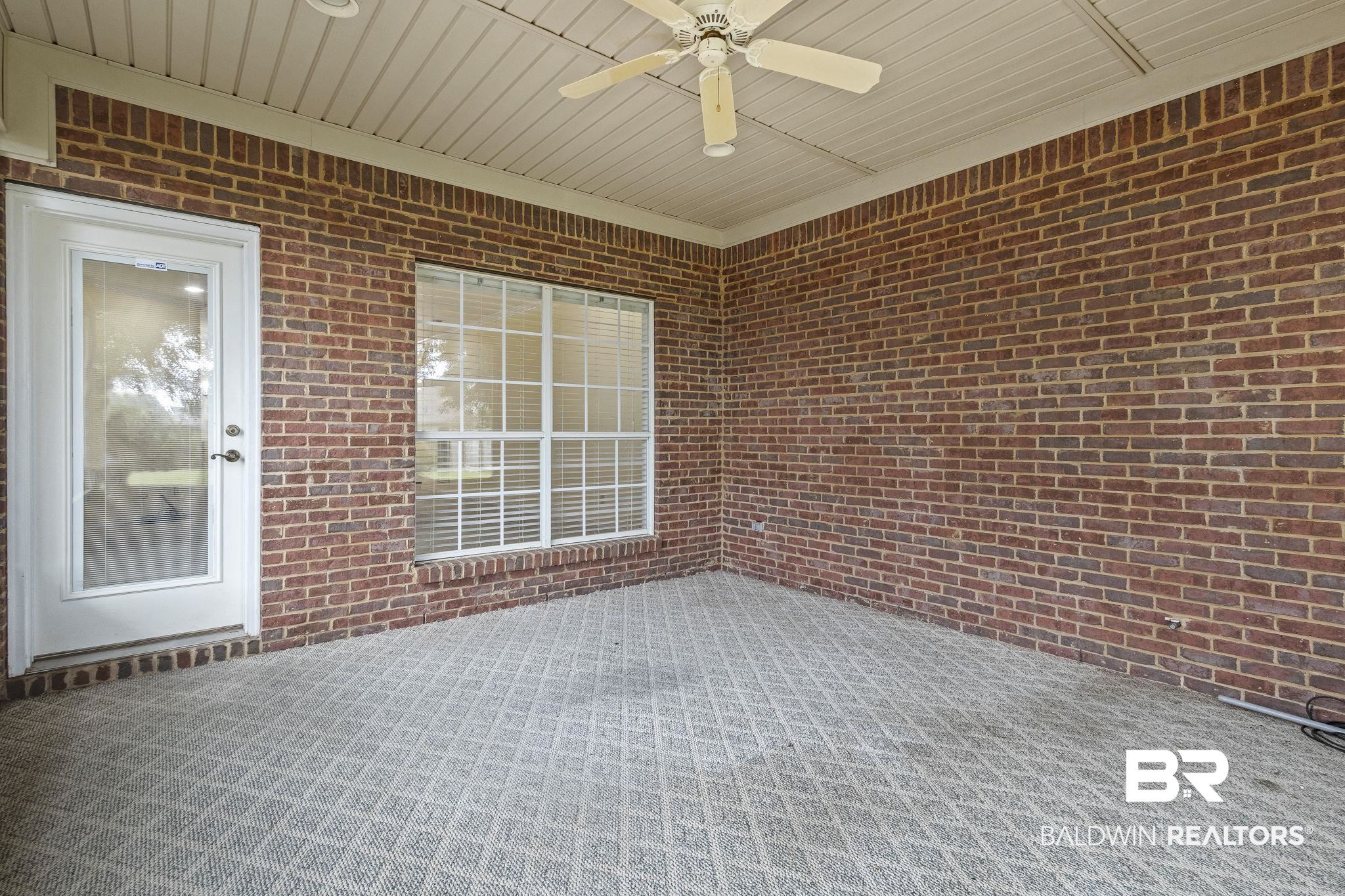 166 Club Drive Fairhope, AL 36532 - Photo 35 of 41 Unfurnished sunroom with ceiling fan