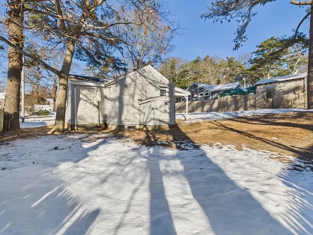 a kitchen with stainless steel appliances granite countertop a sink and cabinets with wooden floor