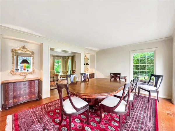 a kitchen with stainless steel appliances kitchen island granite countertop a sink cabinets and window
