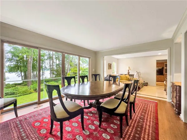a kitchen with stainless steel appliances kitchen island granite countertop a refrigerator and a stove