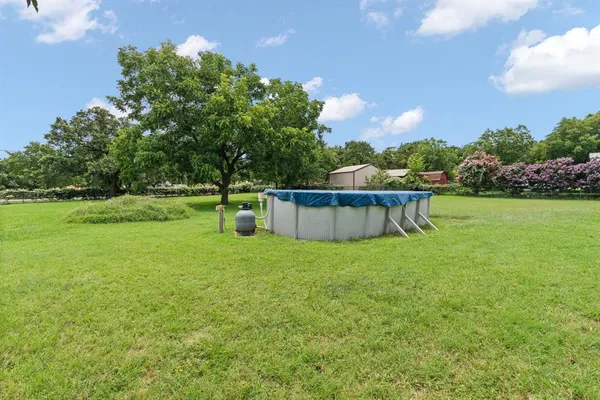 a backyard of a house with lots of green space