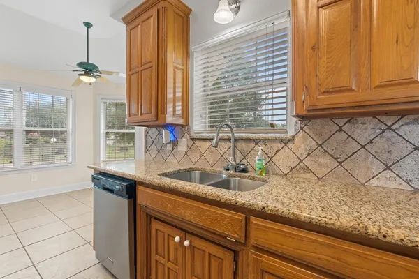 a kitchen with a sink and a window