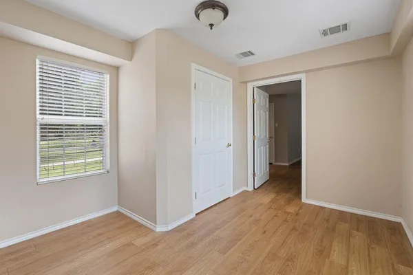 a view of livingroom with hardwood floor and window in a room