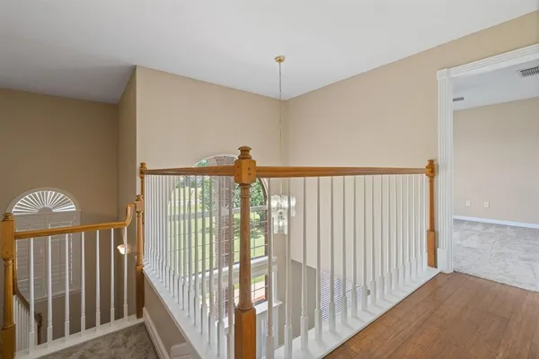a view of a hallway with a window