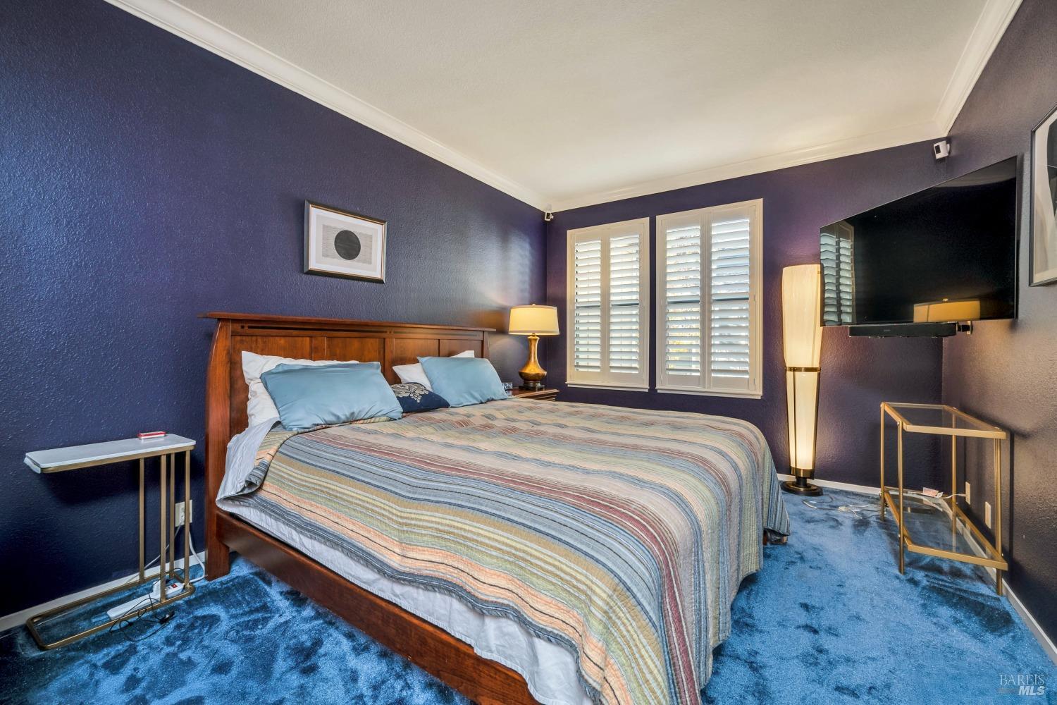 667 Cherry Avenue, Unit 34 Sonoma, CA 95476 - Photo 10 of 20 a bedroom with a bed and a flat screen tv