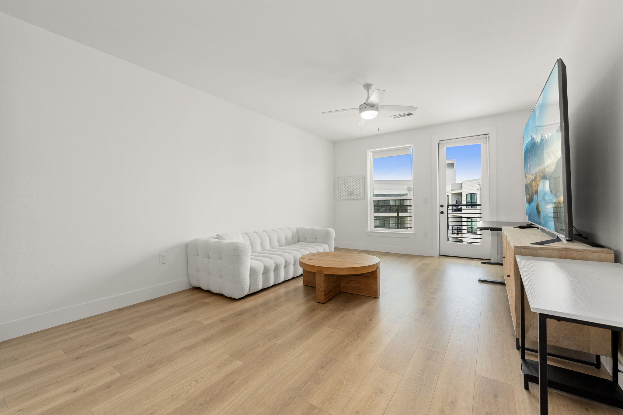 1701 Simond Avenue, Unit 612 Austin, TX 78723 - Photo 6 of 40 a living room with furniture and a wooden floor