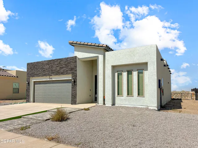 a kitchen with a stove a sink and a refrigerator