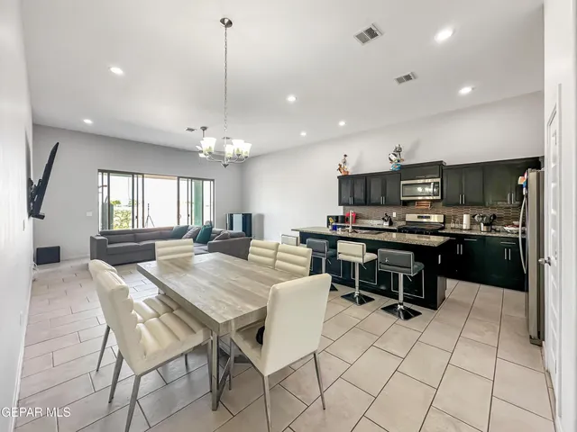a bathroom with a granite countertop sink mirror toilet and shower