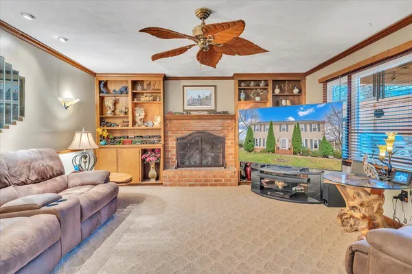 a kitchen with stainless steel appliances granite countertop a sink a stove and a wooden floors