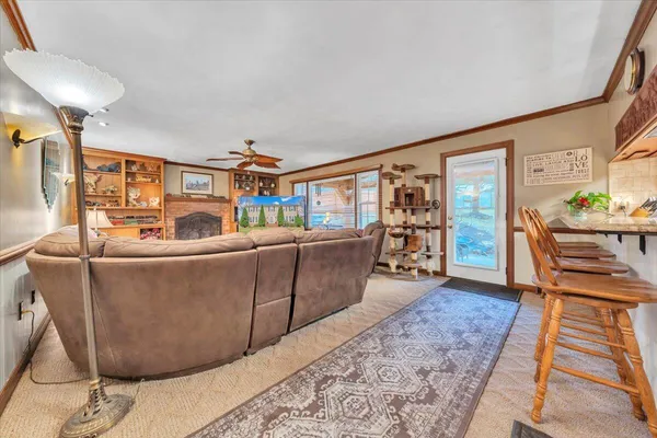 a kitchen with stainless steel appliances granite countertop a sink and a stove