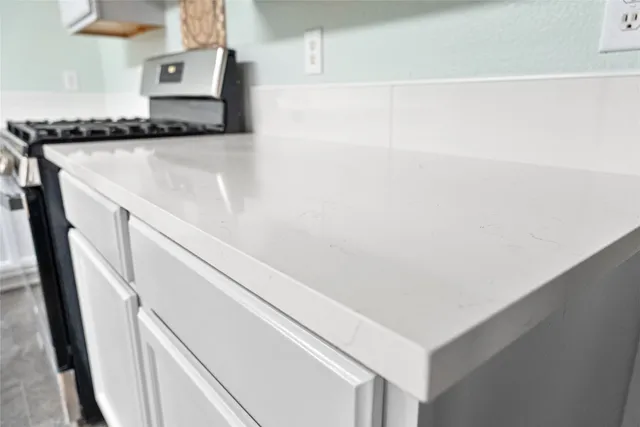 a view of a livingroom with a ceiling fan and window