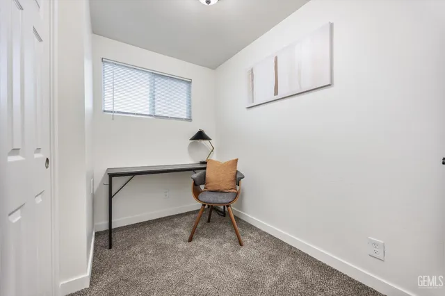 a room that has a rug and a window