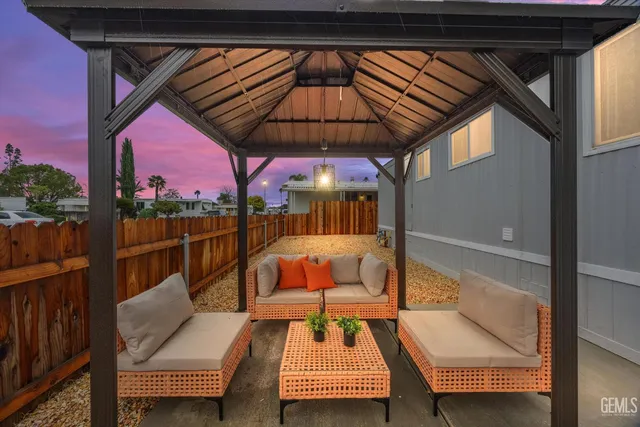 a view of sitting area with furniture and umbrella