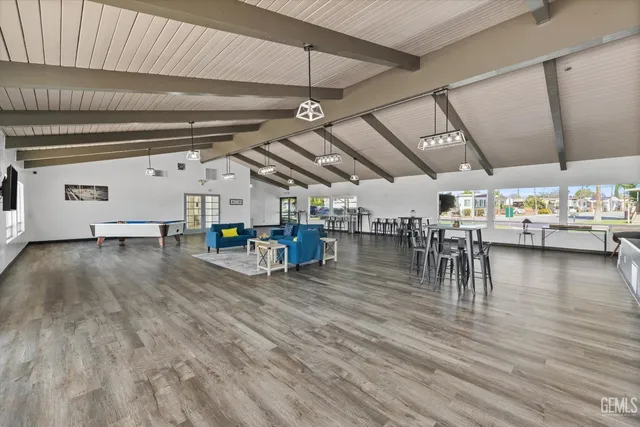 a view of a studio with wooden floor