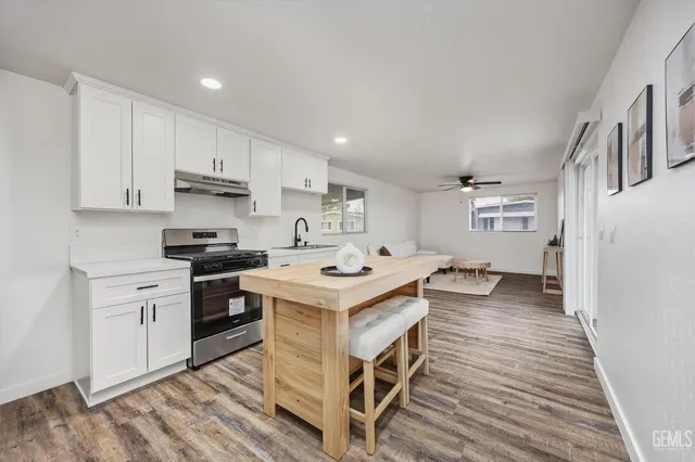 a kitchen with a stove and a refrigerator