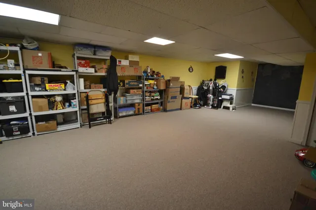 a view of a room with furniture and white walls