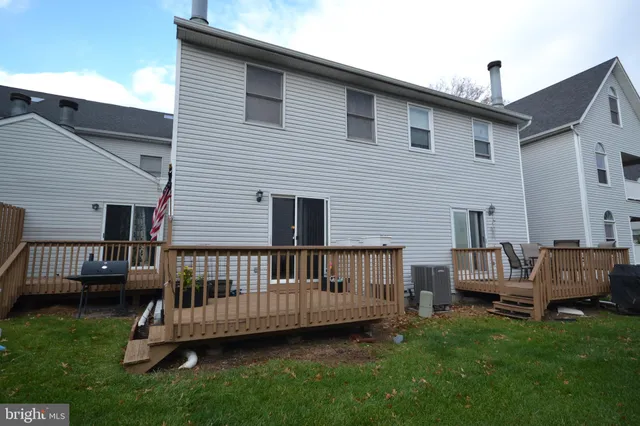 a view of a deck with a chairs in a patio