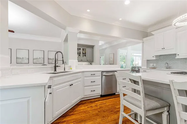 an aerial view of a house with a yard basket ball court and outdoor seating