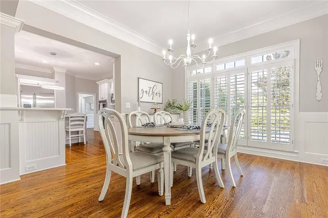 an aerial view of a house with swimming pool and garden space