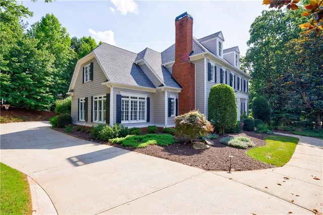 a spacious bathroom with a bathtub and shower