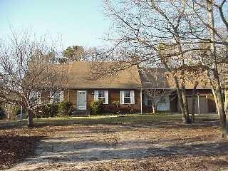 front view of a house with a dry yard