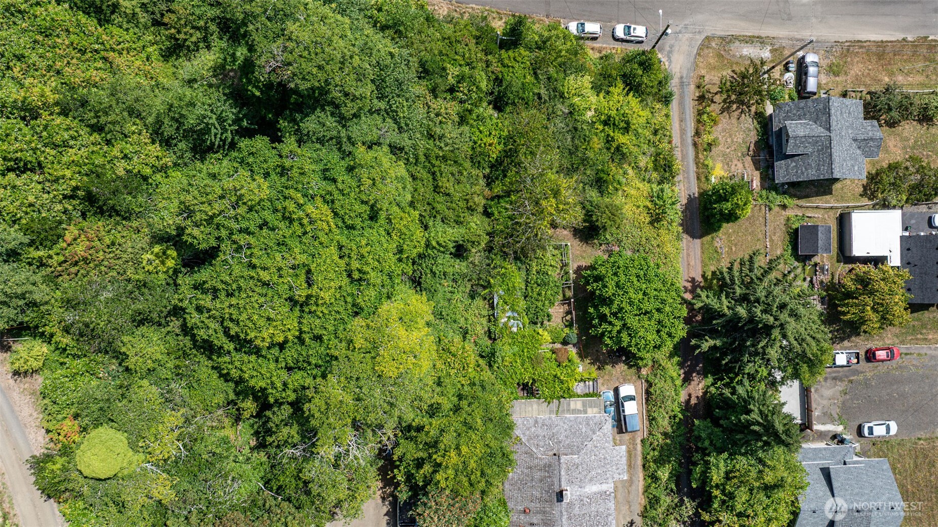 an aerial view of a house with a yard