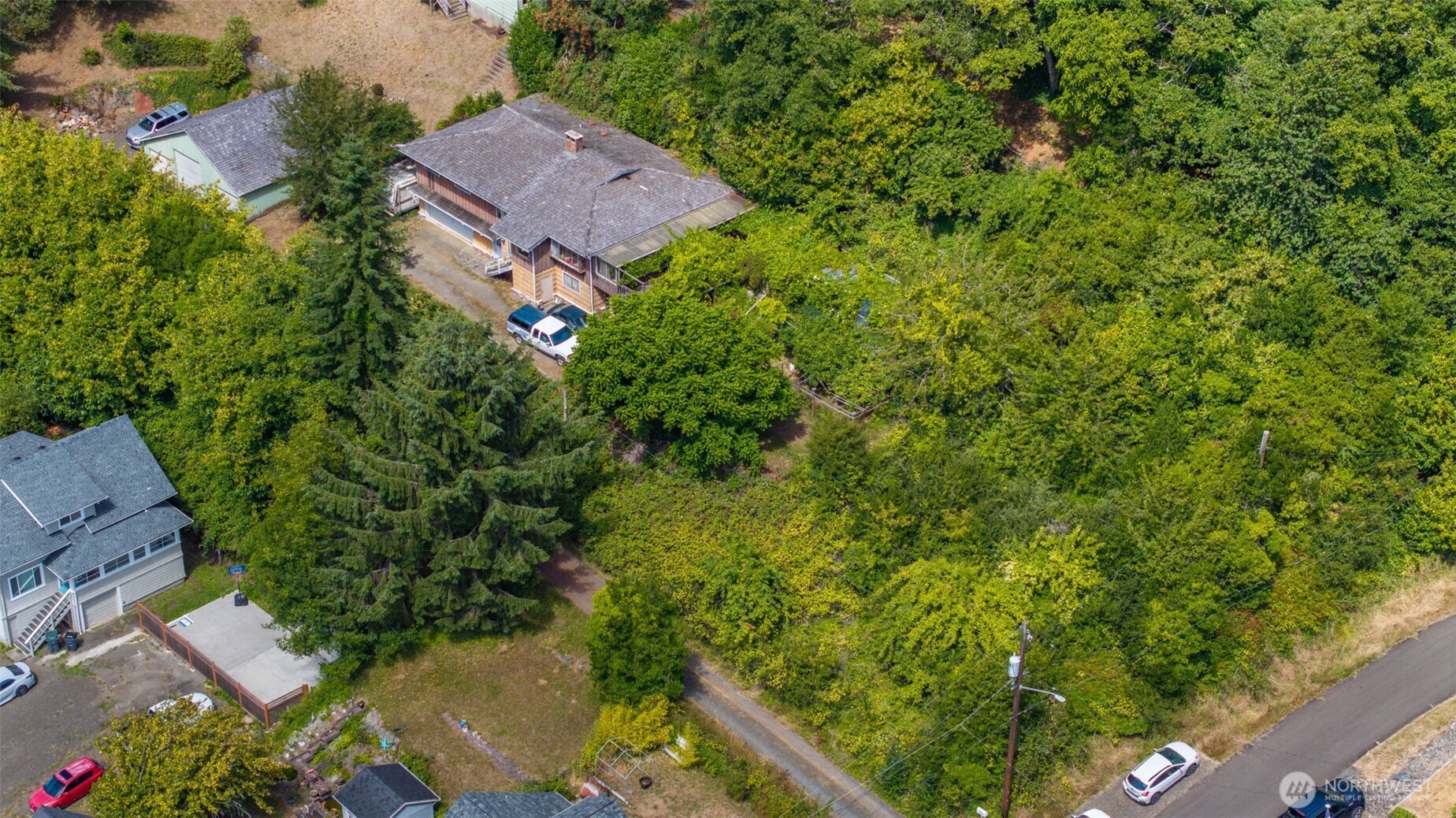 0 West Adams Street Hoquiam, WA 98550 - Photo 4 of 14 an aerial view of a house with a yard