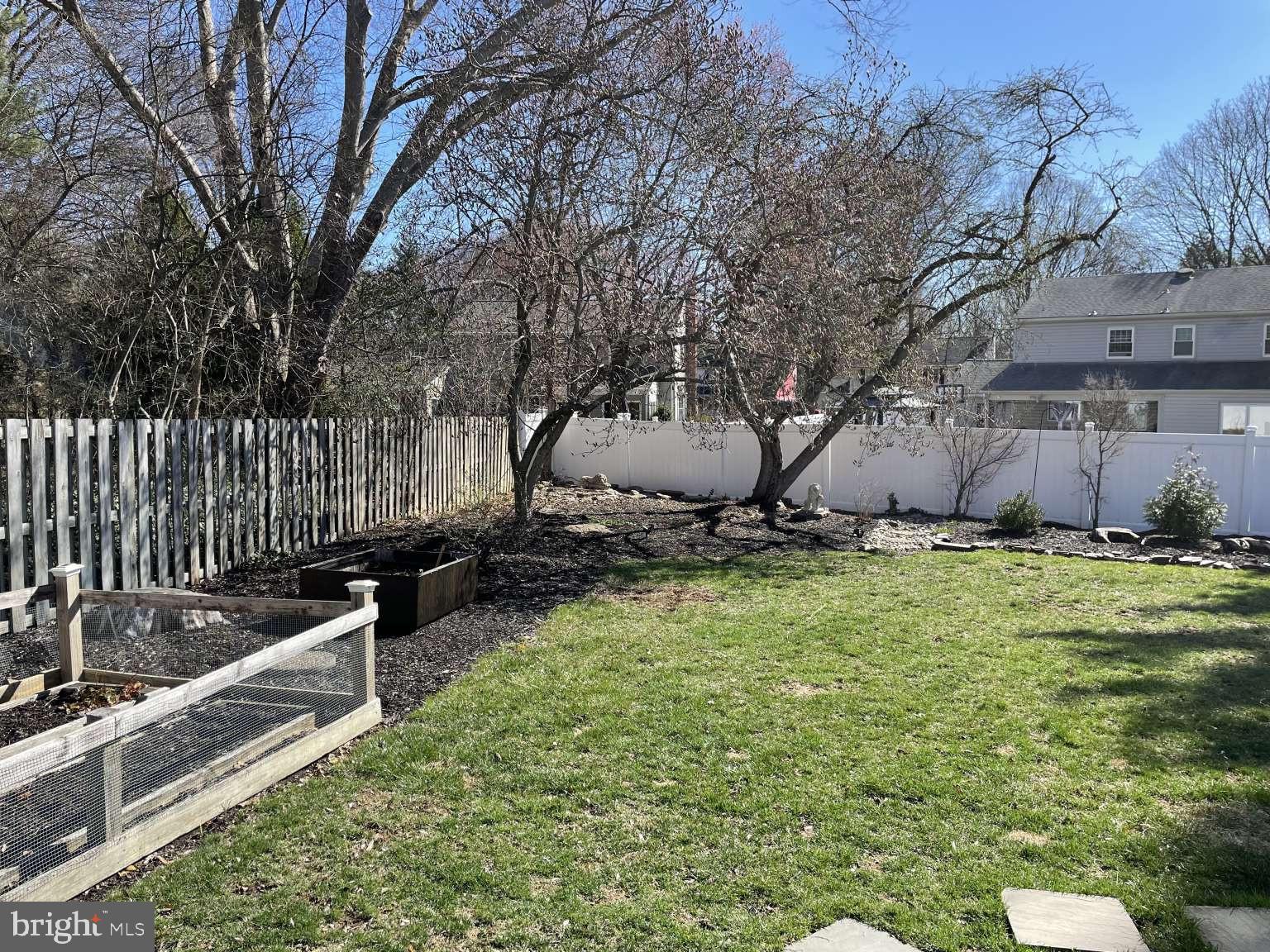 102 Danforth Place Wilmington, DE 19810 - Photo 12 of 21 a view of a backyard with table and chairs with wooden fence