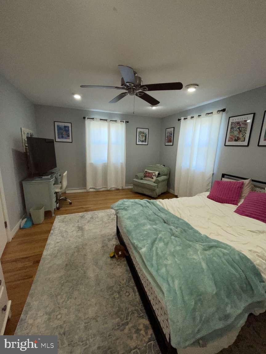 102 Danforth Place Wilmington, DE 19810 - Photo 17 of 21 a bedroom with a bed and a chandelier
