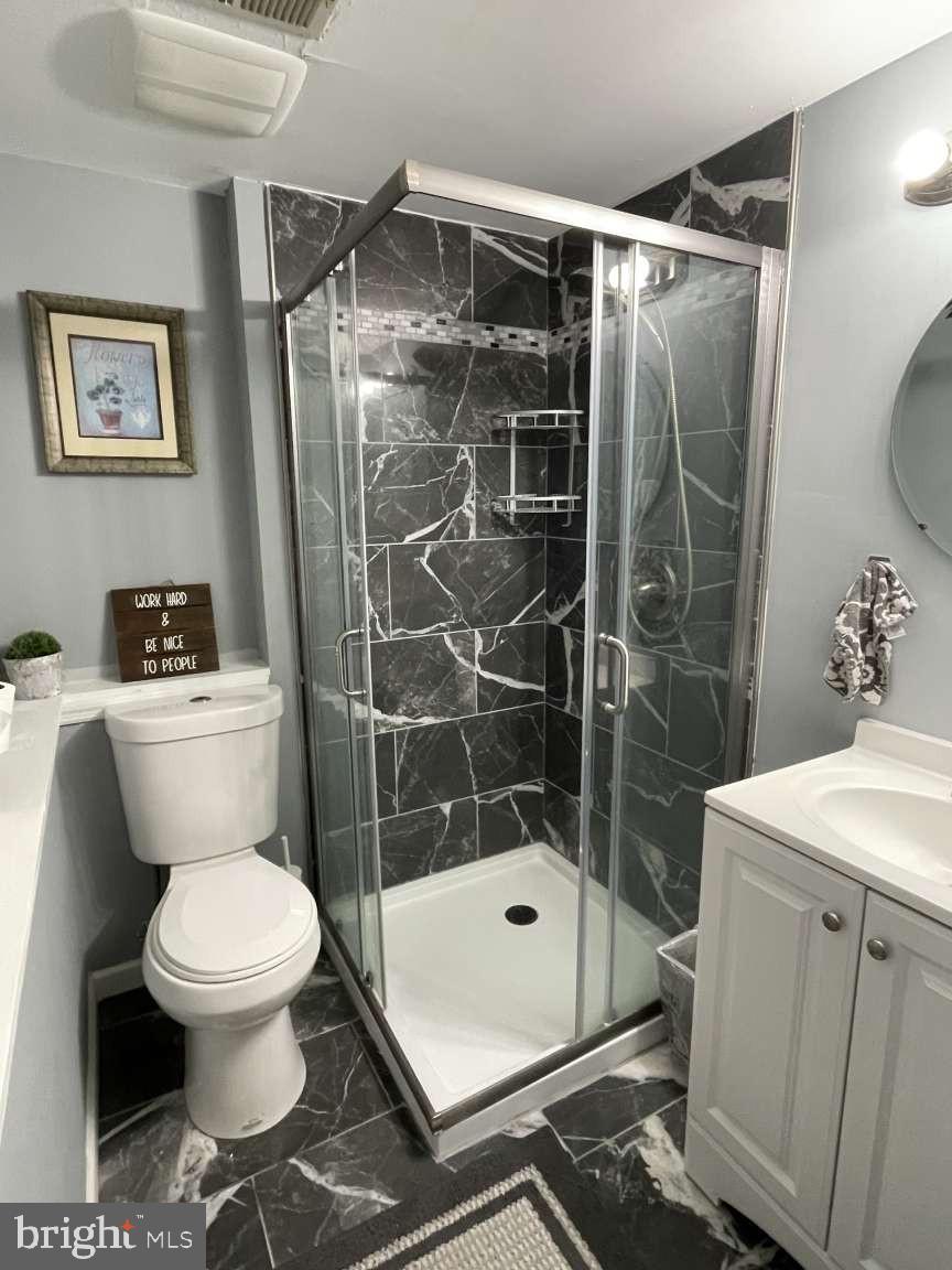 102 Danforth Place Wilmington, DE 19810 - Photo 21 of 21 a bathroom with a toilet a sink and a shower
