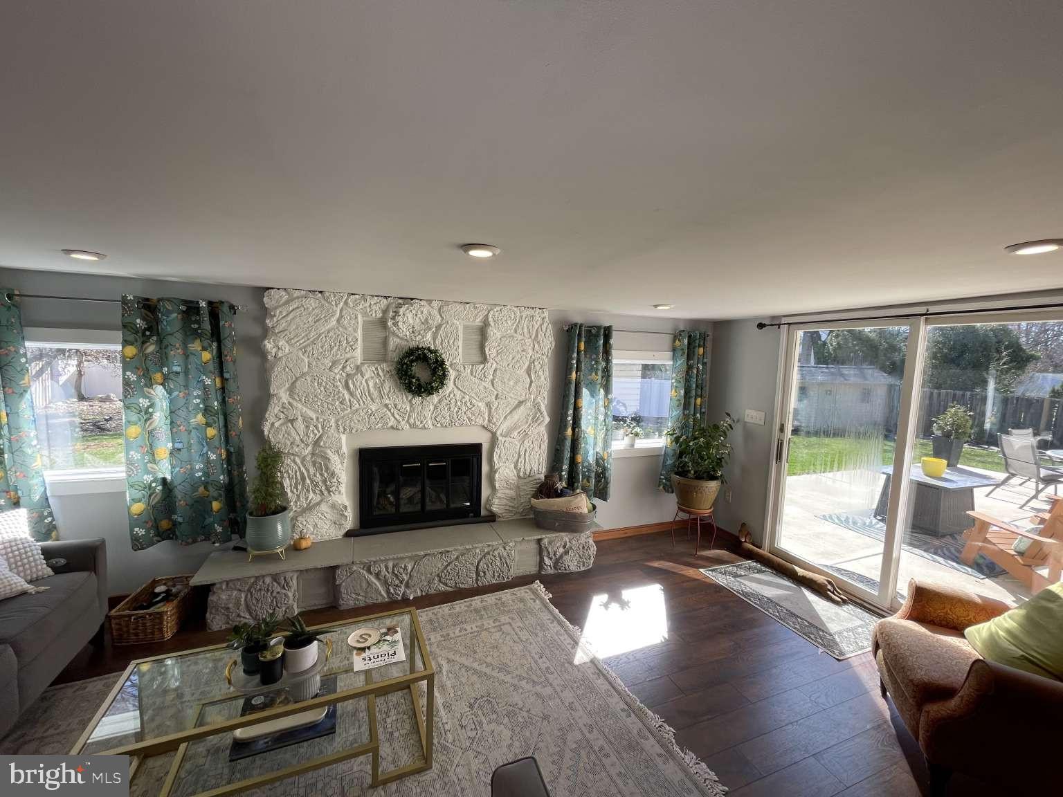 102 Danforth Place Wilmington, DE 19810 - Photo 7 of 21 a living room with furniture and a fireplace
