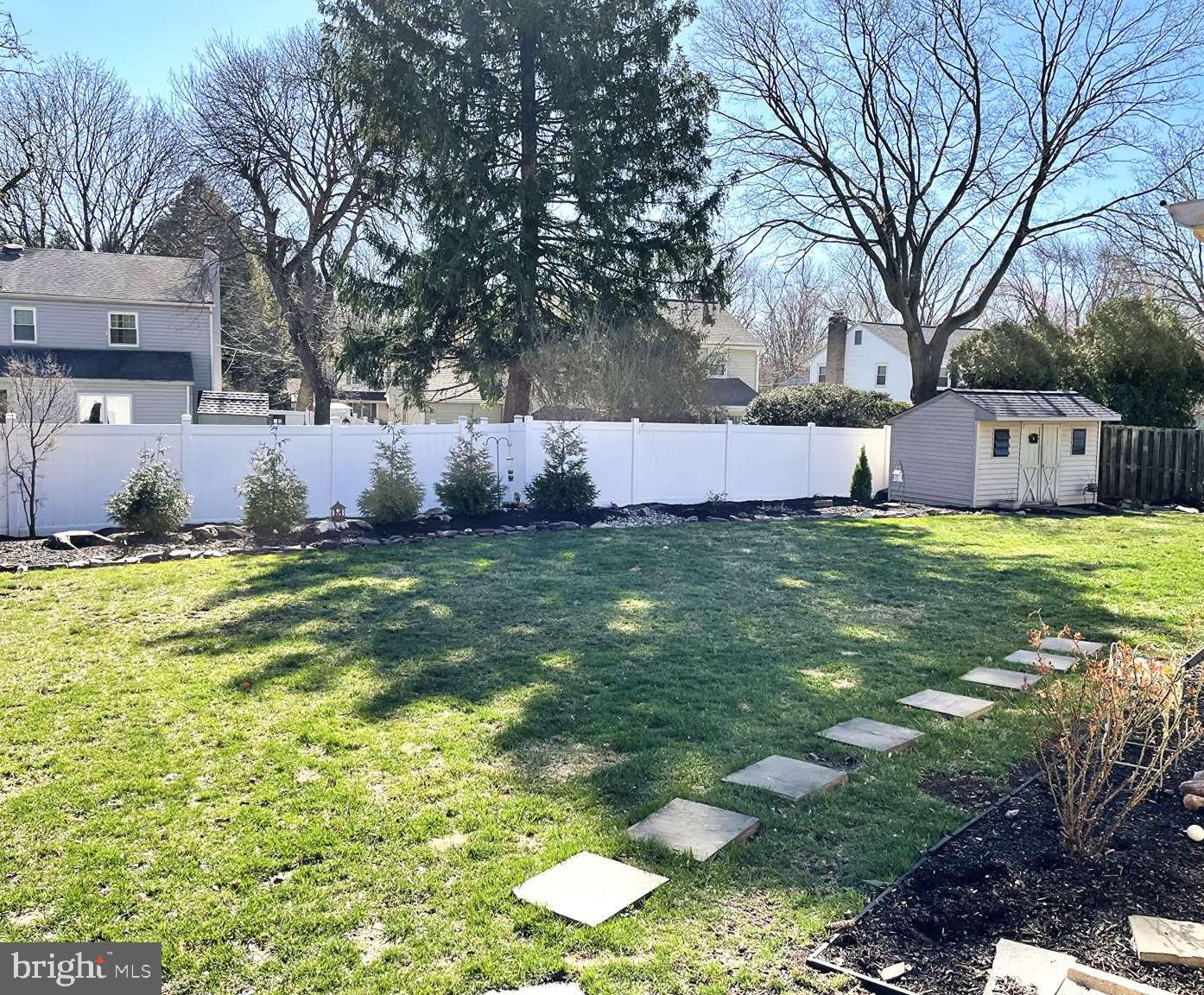 102 Danforth Place Wilmington, DE 19810 - Photo 10 of 21 a view of yard with swimming pool and trees