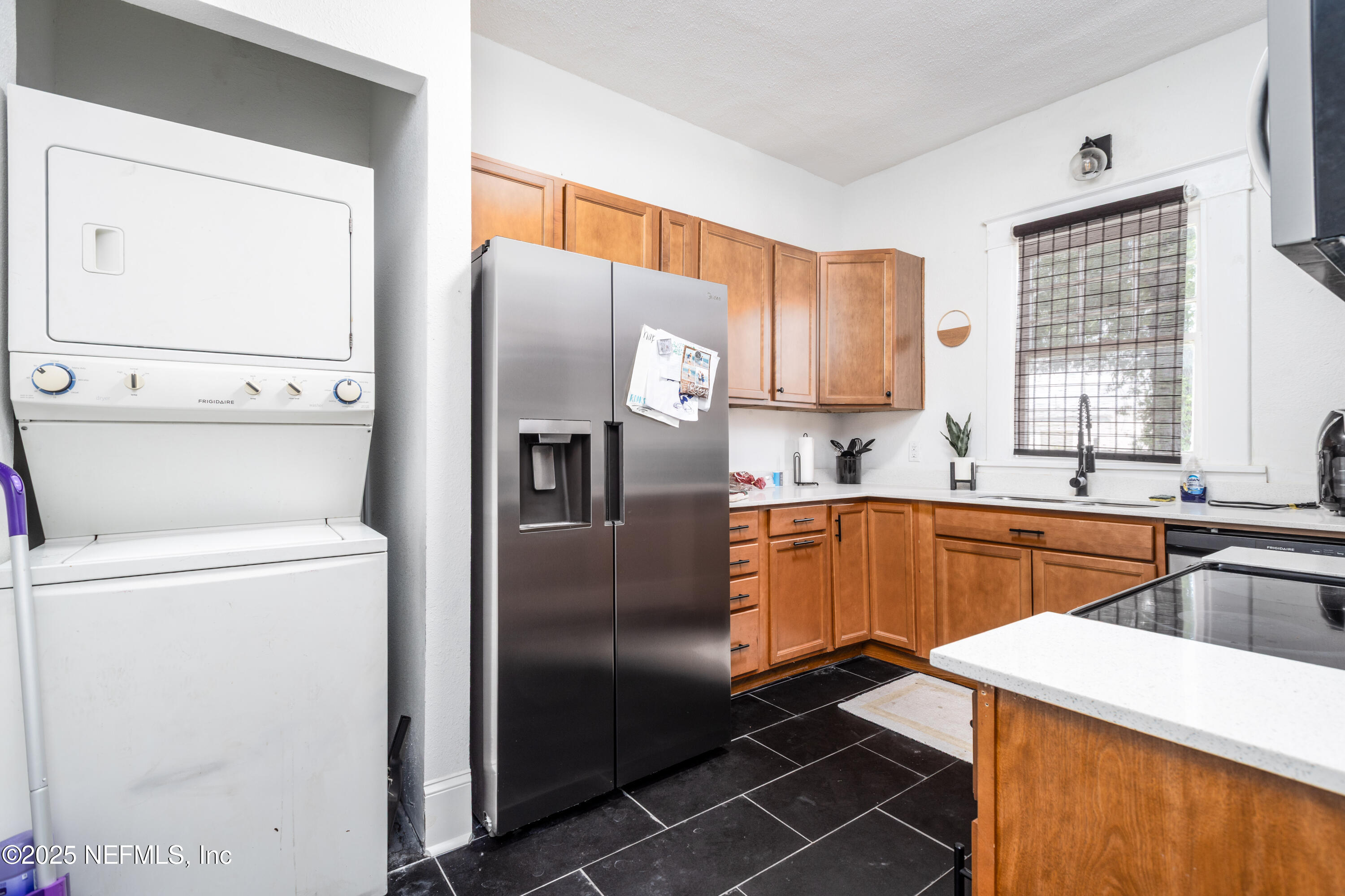 2068 Redwing Street Jacksonville, FL 32206 - Photo 11 of 26 a kitchen with a refrigerator sink and stove