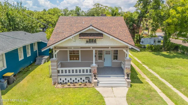 a view of house with a swimming pool