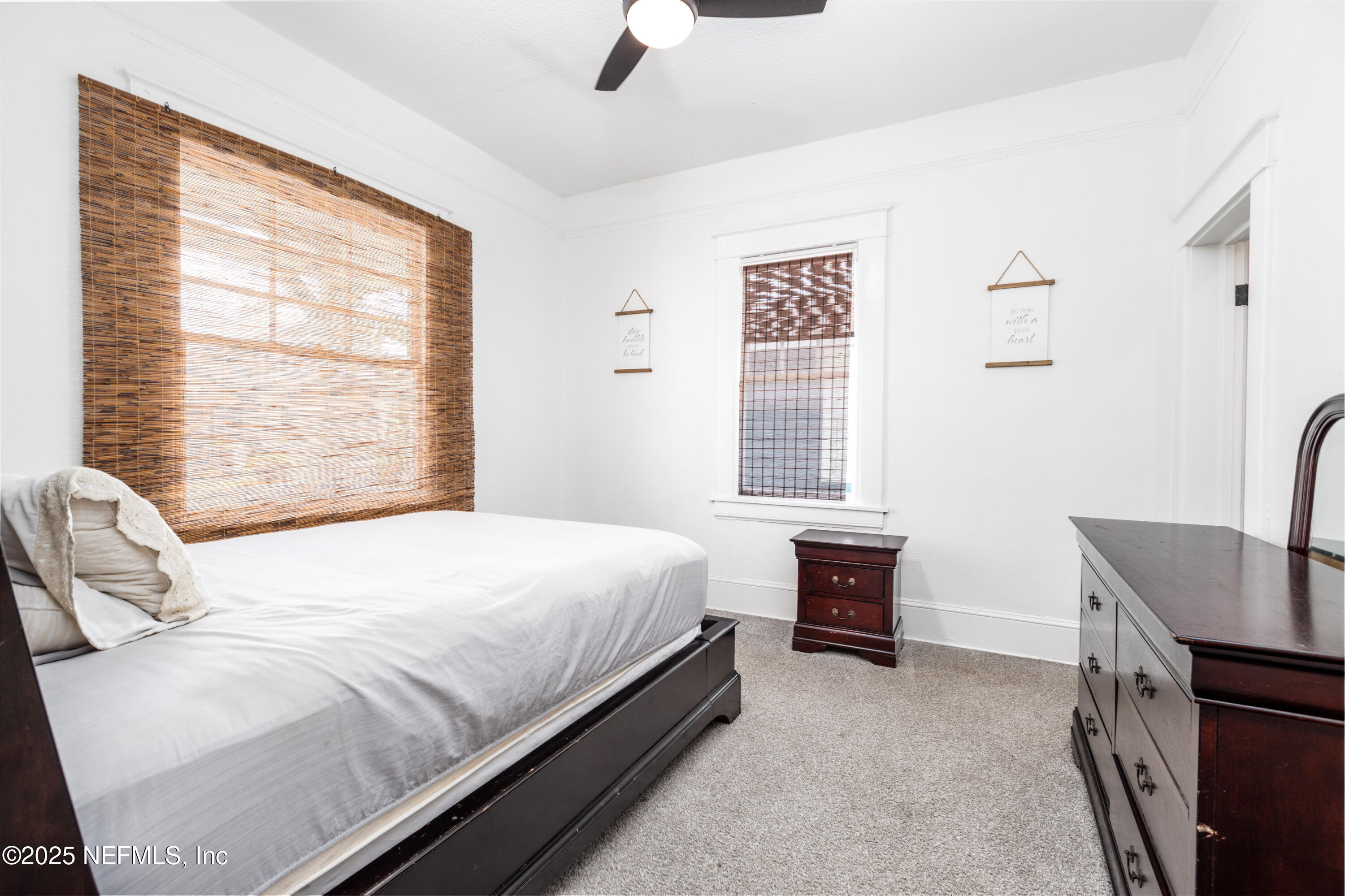 2068 Redwing Street Jacksonville, FL 32206 - Photo 6 of 26 a bedroom with a bed and a couch