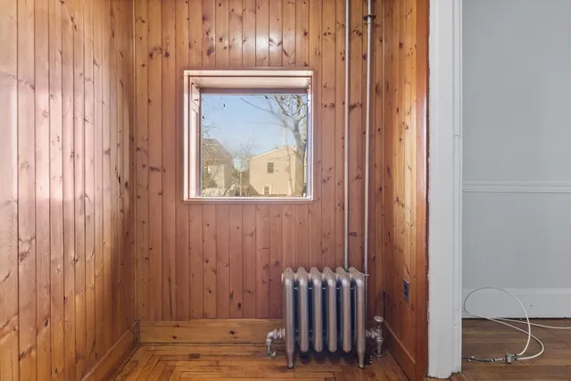 a view of a door and wooden floor