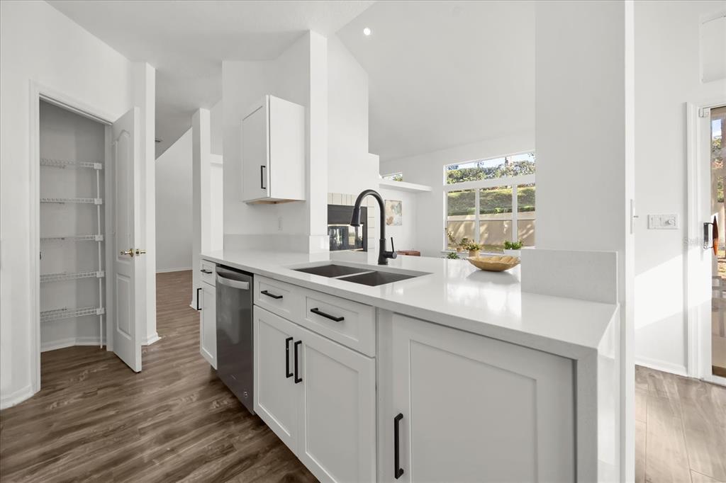 220 Wimbledon Circle Lake Mary, FL 32746 - Photo 14 of 38 a kitchen with stainless steel appliances a sink and a stove