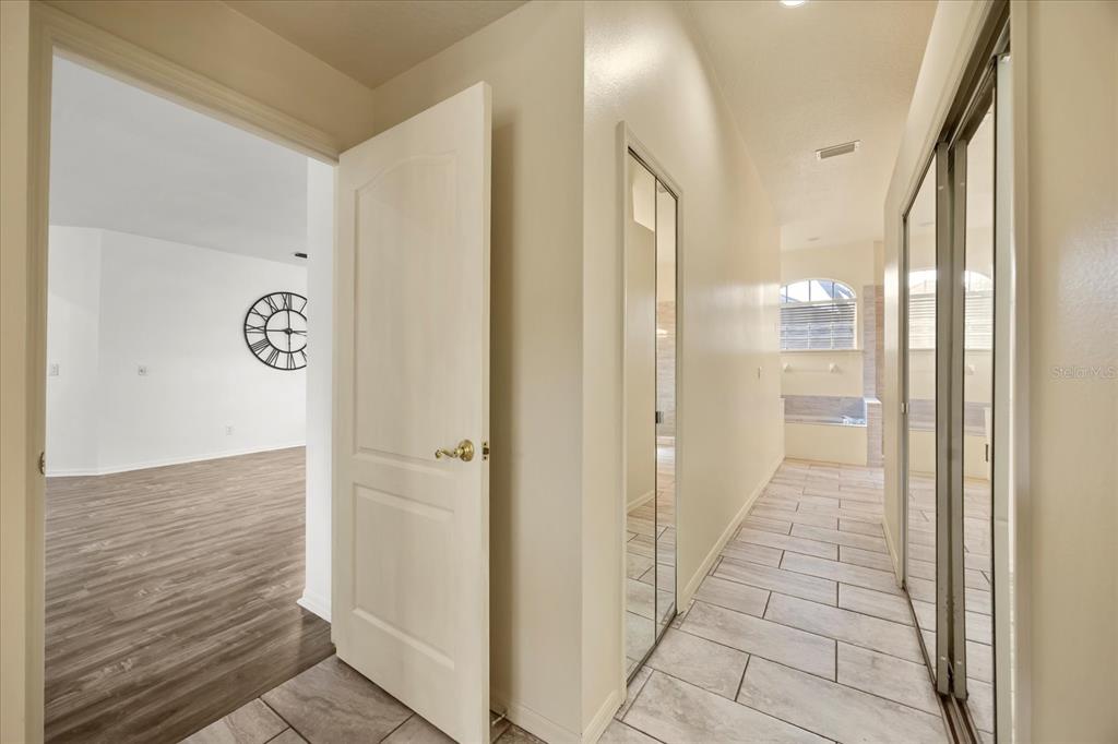 220 Wimbledon Circle Lake Mary, FL 32746 - Photo 19 of 38 a view of a hallway with wooden floor
