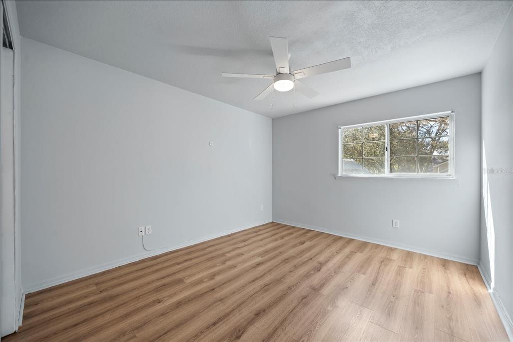 220 Wimbledon Circle Lake Mary, FL 32746 - Photo 29 of 38 a view of empty room with wooden floor and fan