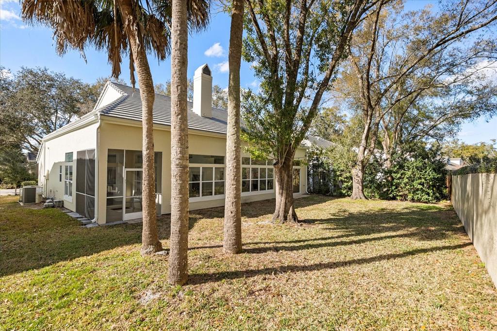 220 Wimbledon Circle Lake Mary, FL 32746 - Photo 35 of 38 a view of a house with trees in the background