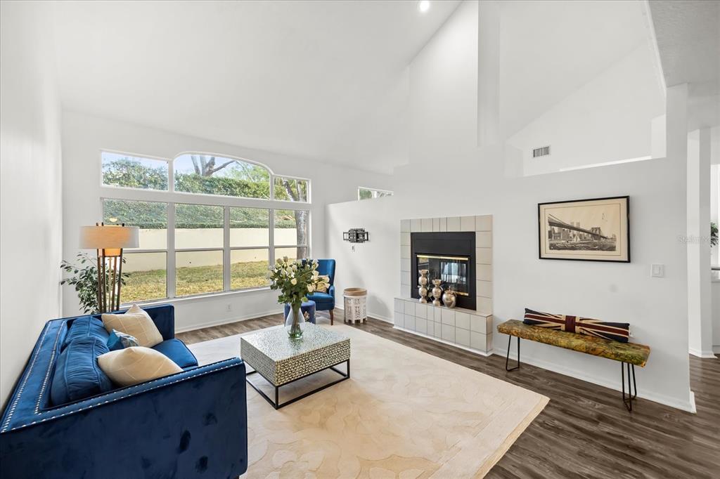 220 Wimbledon Circle Lake Mary, FL 32746 - Photo 7 of 38 a living room with furniture and a large window