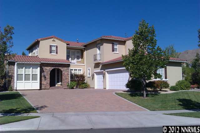 1865 Sun Shadow Court Reno, NV 89523 - Photo 1 of 1 a view of a white house with a large windows and a yard